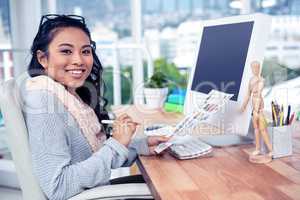 Asian businesswoman holding paper sheet