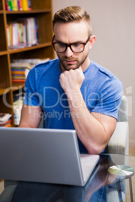 Serious designer working on computer