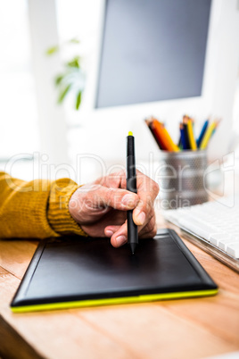 Close up view of businessman using tablet graphic