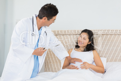 Doctor visiting pregnant woman