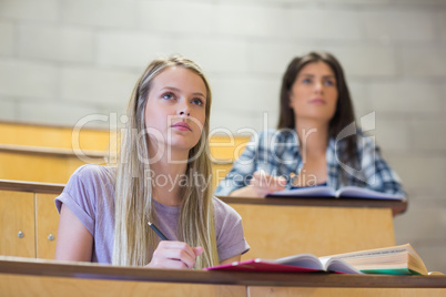 Students sitting beside each other while learning