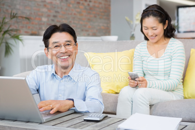 Smiling man counting bills