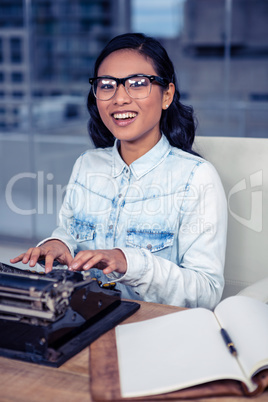 Asian woman typewriting