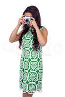 Asian woman taking picture with digital camera