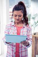 Asian woman using tablet