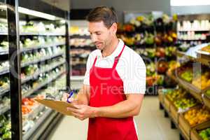 Smiling worker with clipboard