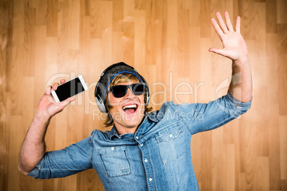 Cheerful hipster listening to music