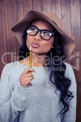 Asian woman holding pencil