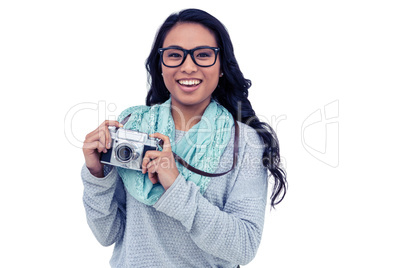 Asian woman holding digital camera