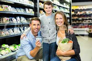 Portrait of family showing credit card