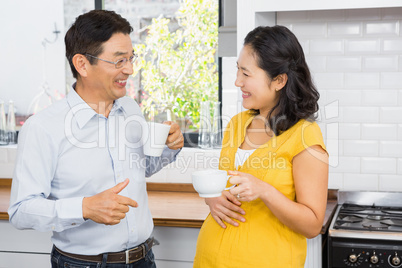 Happy expectant couple talking
