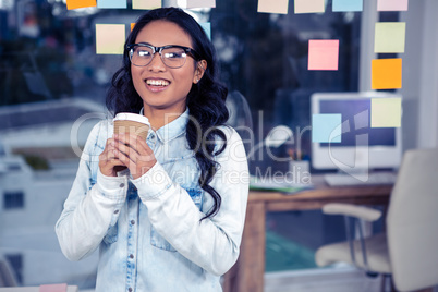 Asian woman holding disposable cup