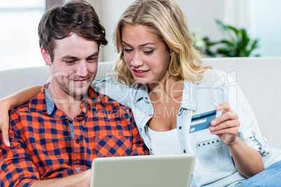 Couple paying with credit card