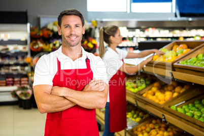 Smiling worker in front of colleague