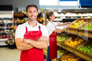 Smiling worker in front of colleague