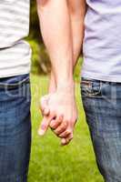 Close up view of gay couple with hand in hand