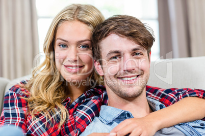 Cute couple cuddling on the couch