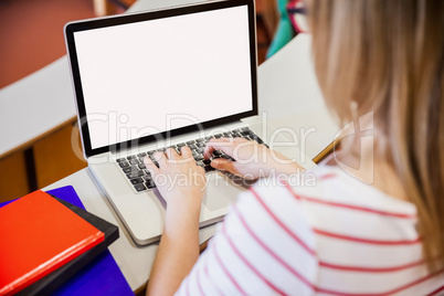 Female student typing on laptop