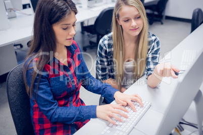 Serious student working on computer