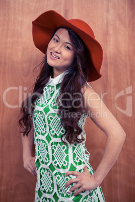 Asian woman with hat posing for camera