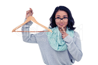 Asian woman holding wooden hanger