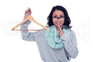 Asian woman holding wooden hanger