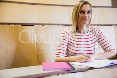 Happy female student looking away