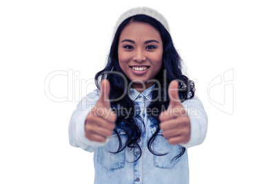 Asian woman showing thumbs up