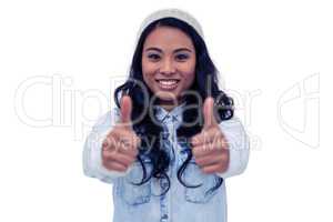 Asian woman showing thumbs up