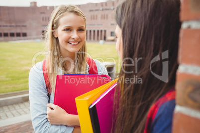 Smiling students talking outdoor