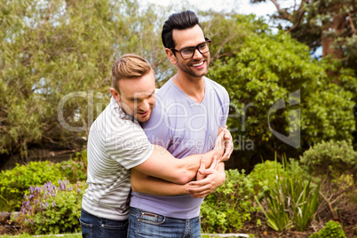 Happy gay couple hugging