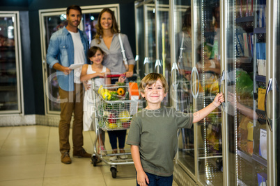 Cute family doing grocery shopping together