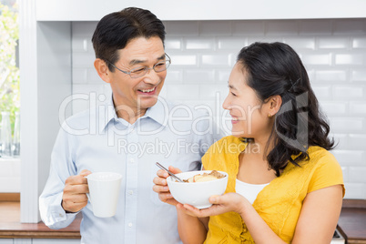 Happy expectant couple in the kitchen