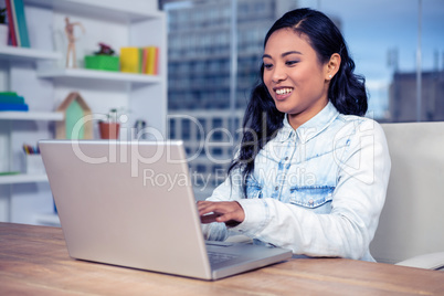 Asian woman using laptop