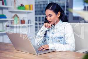 Asian woman using laptop