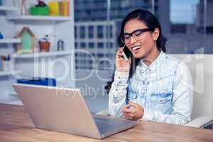 Smiling Asian woman on phone call