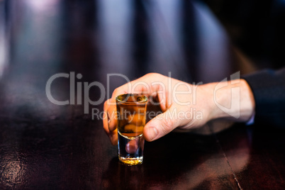 Man holding a shot