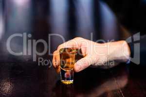 Man holding a shot