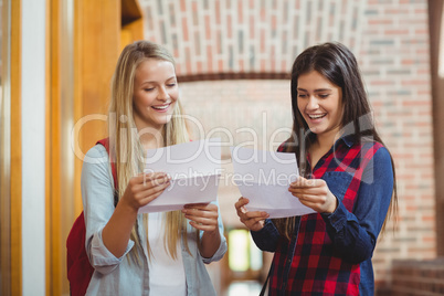 Smiling students looking at results