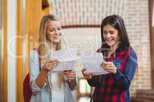 Smiling students looking at results