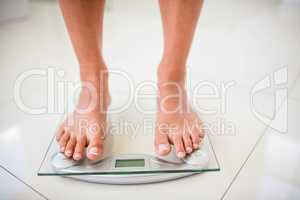 Feet of woman on weighting scale