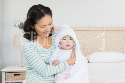 happy mother with baby daughter