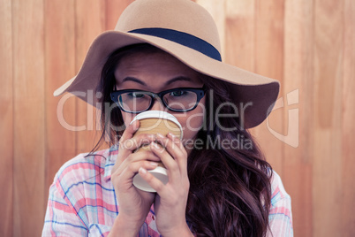 Asian woman drinking by disposable cup