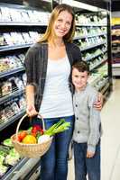 Mother and son doing grocery shopping