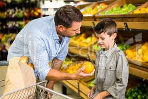 Father and son doing grocery shopping