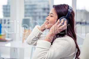 Asian woman using headphones