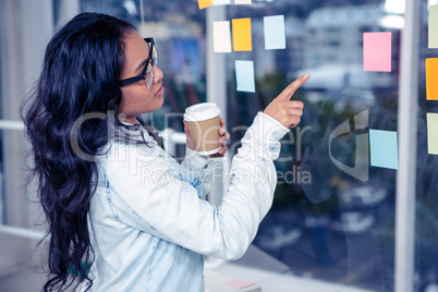 Asian woman pointing sticky note