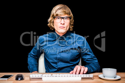 Focused hipster businessman using computer