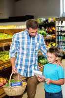 Father and son doing shopping