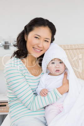 Happy mother with baby daughter